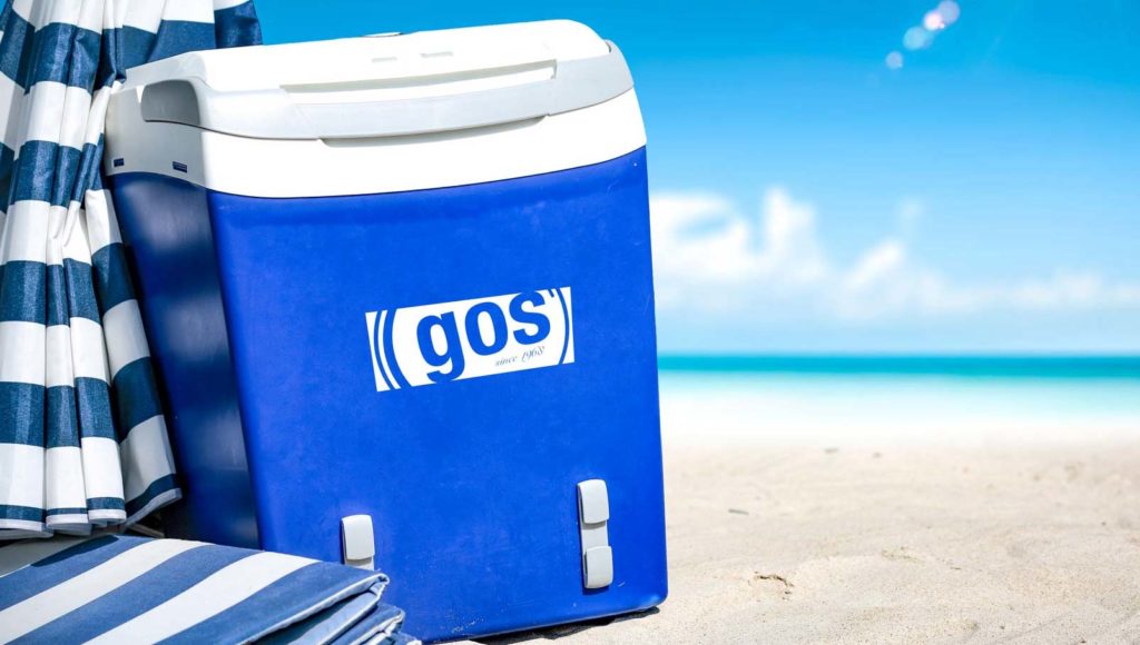 Cooler with company logo on it at the beach